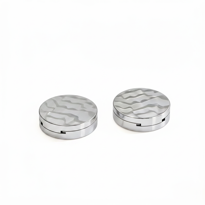Round chrome silver wave-lid powder compact open showing mirror and blush pan hero shot