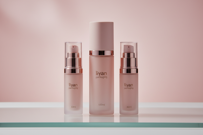 Three airless pump bottles in 30ml, 50ml and 100ml sizes on frosted glass