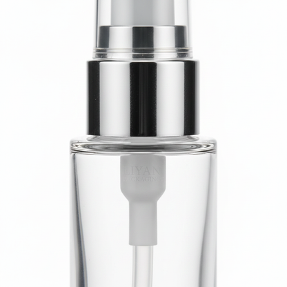Glass pump bottle detail - silver pump head close-up