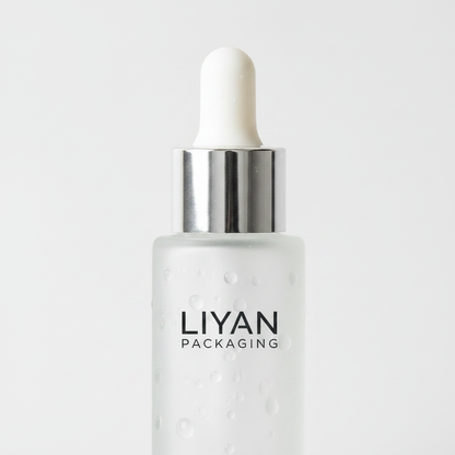 Frosted glass dropper bottle detail - silver dropper cap close-up