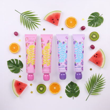Overhead flat lay of four fruit hand cream tubes with colorful fruit slices on white background