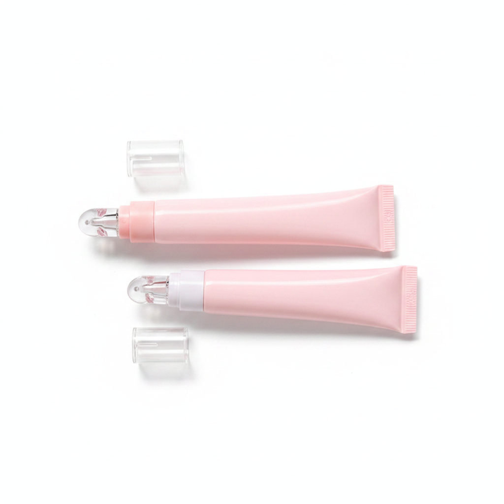 Pink eye cream roller pen tube lying flat with cap