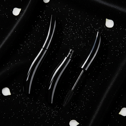 LYH004 mascara tube flatlay on black velvet with silver glitter and orchid petals