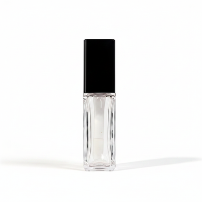 Square thick-wall clear lip gloss bottle with black cap white background hero shot