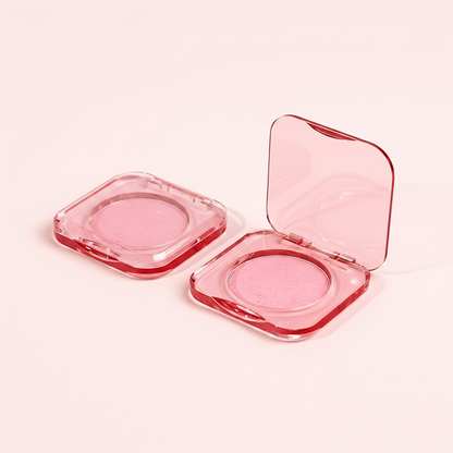 Transparent pink clear-lid compact close-up showing blush powder through clear lid
