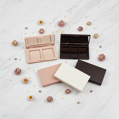 Slim rectangular palette cases flat lay on marble with dried flowers