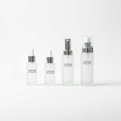 Frosted glass skincare set white background studio shot