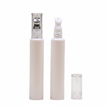 Close-up of slim pump bottle showing transparent cap and silver pump head detail